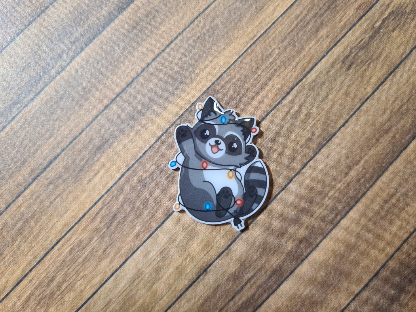 Cover Minder - Waschbär mit Lichterkette